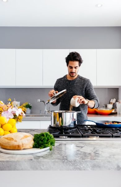 man standing inside kitchen room